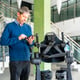 Mechanical exoskeleton computer engineer looking at the robot with a tablet Physiotherapy in a modern hospital Robotic skeleton Physiotherapy Rehabilitation Scientists Engineers and Physicians