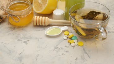 Various flu medications and cold remedies on a white wooden table ... Cold. illnesses. cold. flu.