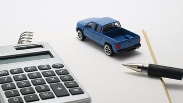 High angle view of diary with pen and toy car on white background