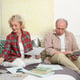 Senior couple calculating taxes at home