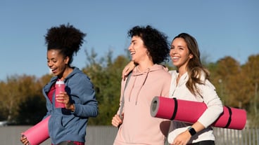 Medium shot women with yoga mats