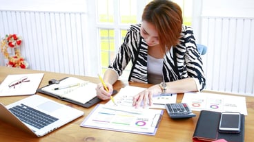 Young businesswoman working at a desk in the office