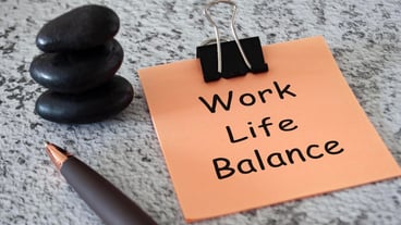 Work life balance text on sticky notes with pen and stack of zen stones Life balance concept