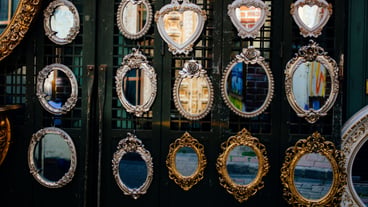 Mirrors of various sizes and shapes in the view