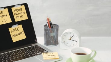 Cutout image of woman holding paper sticker with word ideas near laptop computer.