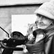 Portrait of senior woman wearing warm clothing and knit hat in city