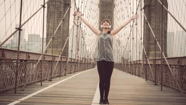 Full length of woman standing on bridge
