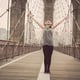 Full length of woman standing on bridge