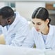 High angle view of two workers in laboratory doing medical research