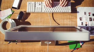 Cropped image of woman typing on keyboard
