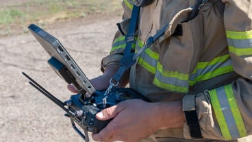 Latin firefighter piloting rescue drone