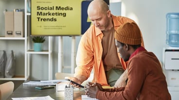 Two Men Discussing Marketing Trends