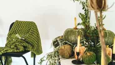 Beautiful autumn table decor with green pumpkin