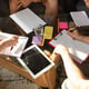Group of young Caucasian office workers meeting to discuss new ideas. Creative meeting. Teamwork and brainstorming. Men and women meet in the office to plan their future work. Business concept.