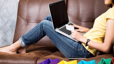 Asia woman shopping online at home. Searching product in shopping website and pay by credit card.Copyspace shopping online and delivery product at home concept.