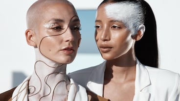 Bridging the gap between art and the real world Closeup shot of two beautiful young women showing off unconventional makeup looks