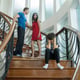The boy is closing his ears between parents quarrel fighting. Stop violence concept.