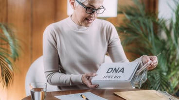 Senior woman taking a DNA test sent to her home.