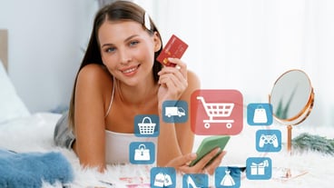 Consumer holding credit card typing phone shopping online inventory cybercash