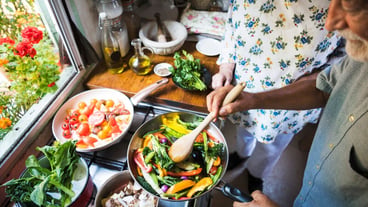Elderly couple cooking in the kitchen