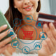 Consumer holding credit card typing phone shopping online inventory Cybercash