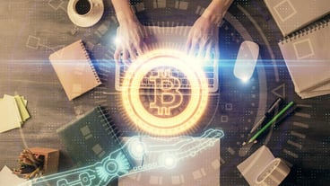 Double exposure of woman hands working on computer and blockchain theme hologram drawing Top View bitcoin cryptocurrency concept