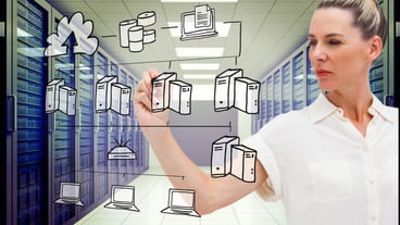 Serious businesswoman against server room with towers
