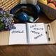 New years resolutions goals motivational phrase in open notebook on the table outdoor still life
