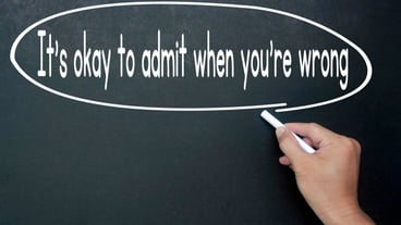 Hand writing It is okay to admit when you are wrong affirmation on black board Affirmation concept