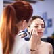 Make-up artist doing make-up beautiful girl in the salon, beauty concept and style.
