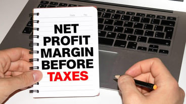Business Term Business Phrase on Tablet PC with a cup of coffee Pens Calculator and yellow note pad