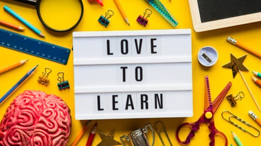 Love to learn lightbox message on a bright yellow background