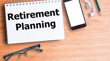 Retirement planning on blank notebook