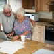 Senior woman using laptop in the kitchen at home