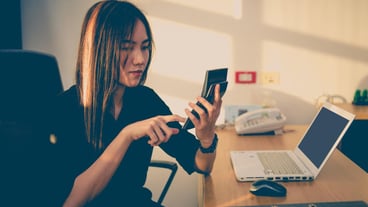Asian officer woman thinking about workShe used the calculator calculates cost