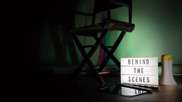 behind the scenes letterboard text on lightbox or cinema light box. movie clapperboard megaphone