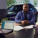 Agent discussing with couple wanting to lease vehicle close up