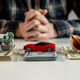 Us dollar banknotes.money for new purchases. saving money for car, house, travels. savings concept. A small house, car and shell lies on a table of thousand dollars thousand dollars.High quality photo