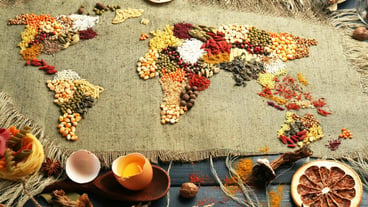 Spices on sackcloth on wooden background