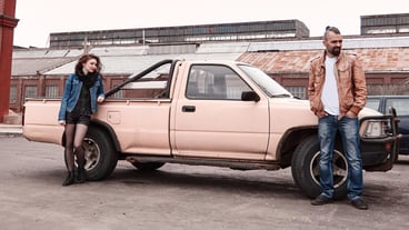 Frustrated young couple standing near their car . the concept of the relationship