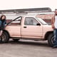 Frustrated young couple standing near their car . the concept of the relationship