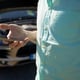 Road trip, transport, travel, technology and people concept - close-up of a man with a smartphone and a broken-down car