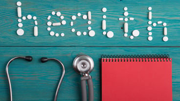 Health concept pills stethoscope clipboard