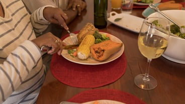 Senior couple having meal on dining table at home