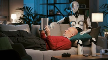Senior man and android robot reading a book together