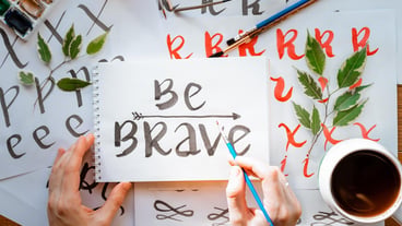 Calligraphy sheets paper hobby lettering flat lay motivational letters words quote be brave