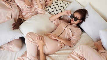 Cool Young Woman Lying on Bed
