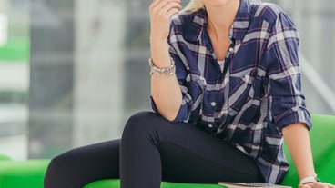 Woman biting pen