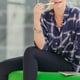 Woman biting pen