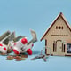 Saving money for a new house concept with broken piggy bank